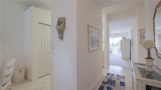 corridor featuring light tile patterned floors