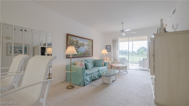 living room featuring ceiling fan and light colored carpet