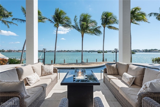 view of patio with an outdoor hangout area and a water view