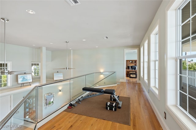 interior space with light hardwood / wood-style floors and a healthy amount of sunlight