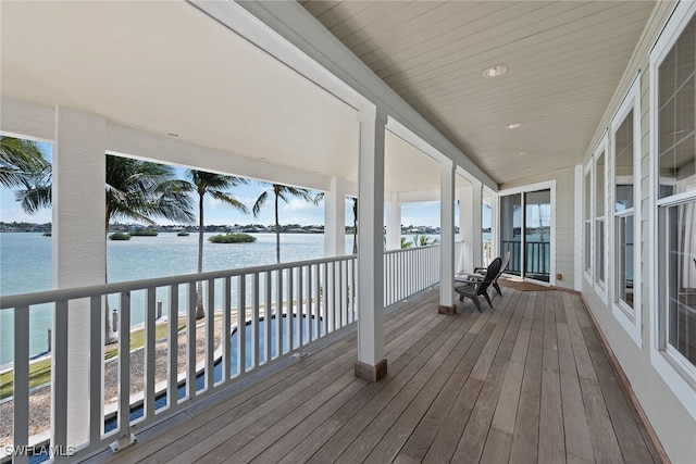 wooden terrace with a water view