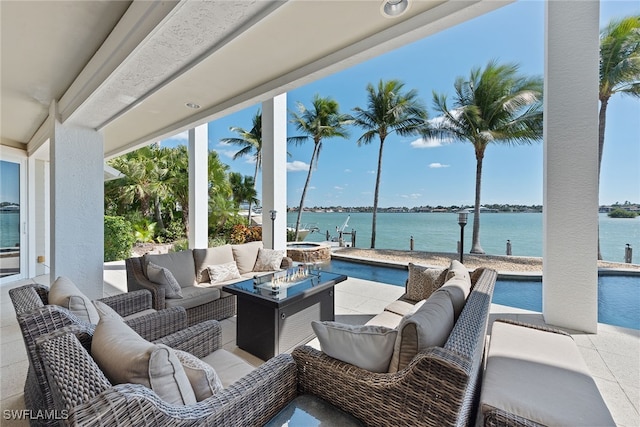 view of patio with a water view and an outdoor hangout area