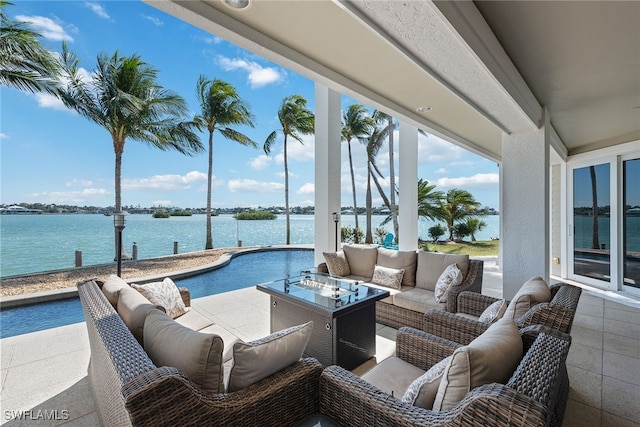 view of patio featuring an outdoor living space and a water view