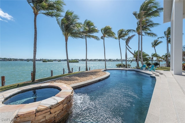 view of pool with a water view and an in ground hot tub