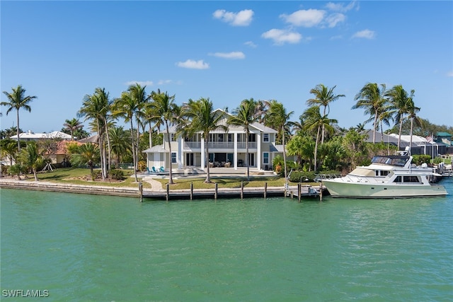 view of dock featuring a balcony and a water view