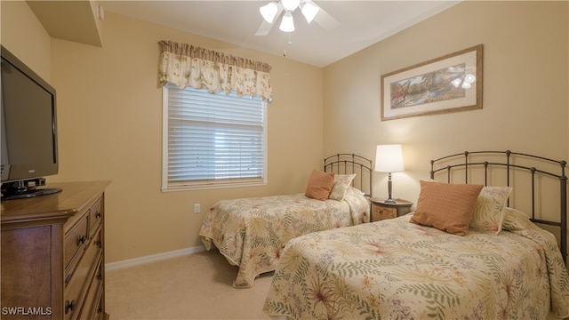 bedroom with light carpet and ceiling fan