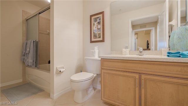 full bathroom featuring tile patterned flooring, toilet, vanity, and combined bath / shower with glass door