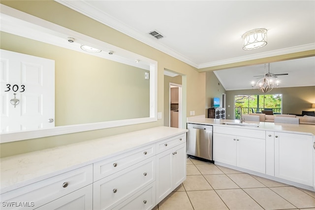 kitchen featuring dishwasher, sink, lofted ceiling, white cabinetry, and crown molding