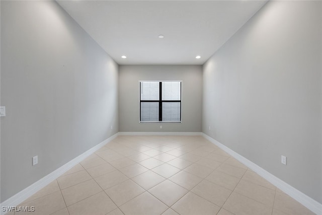 unfurnished room featuring light tile patterned floors