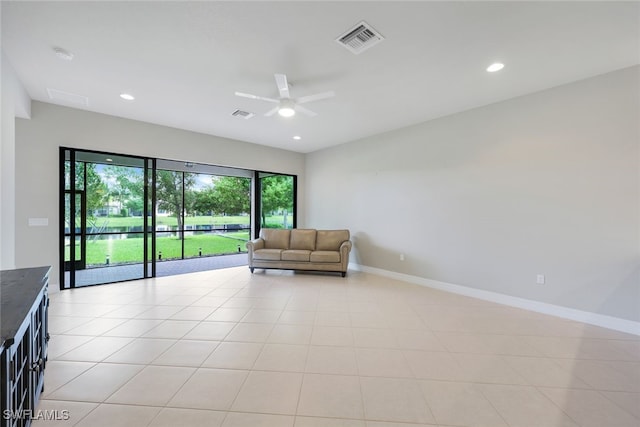 interior space featuring ceiling fan and light tile patterned flooring