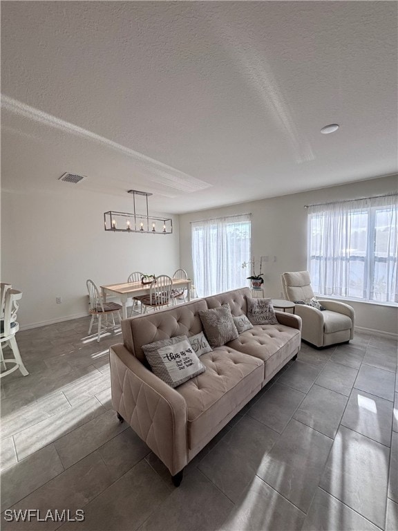 living room with a textured ceiling