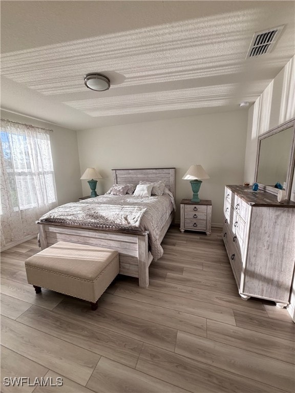 bedroom with light hardwood / wood-style floors