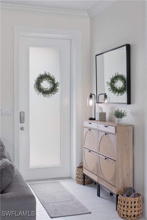 doorway featuring ornamental molding