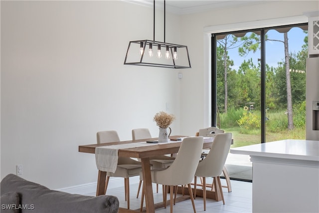 dining space featuring ornamental molding