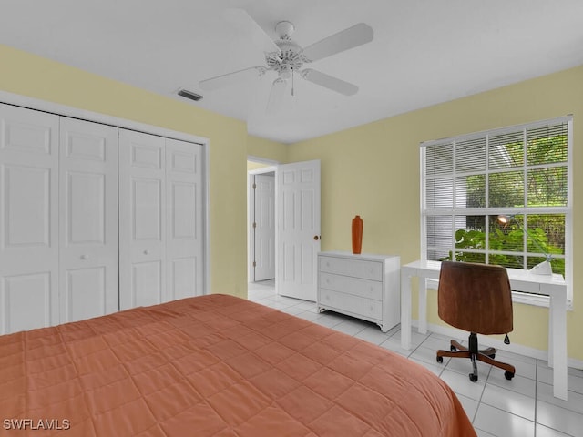 tiled bedroom with ceiling fan