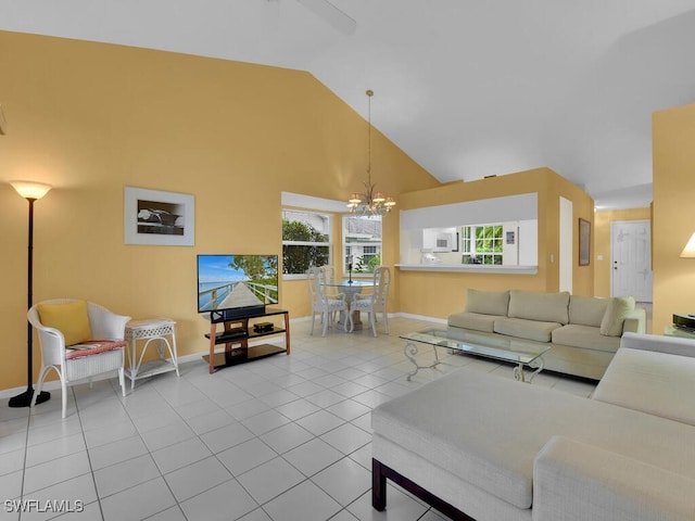 living room featuring a notable chandelier, high vaulted ceiling, and tile patterned floors