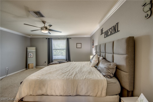 carpeted bedroom featuring ornamental molding and ceiling fan