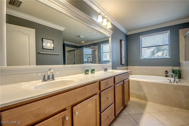 bathroom with ornamental molding, vanity, separate shower and tub, and tile patterned floors