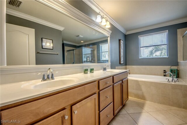 full bathroom with tile patterned flooring, a sink, visible vents, ornamental molding, and a shower stall