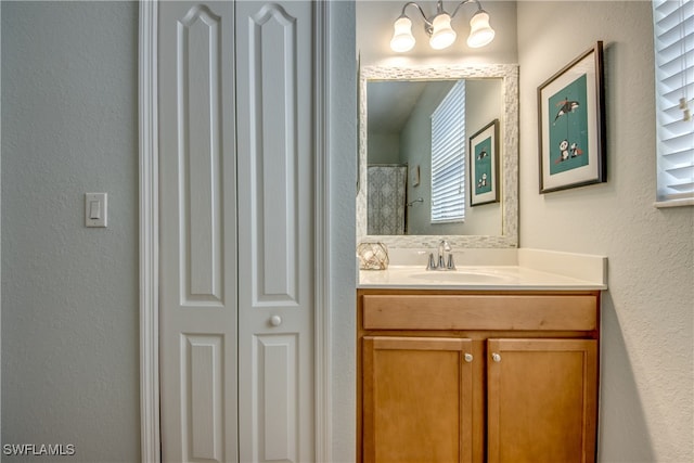 bathroom with vanity and plenty of natural light