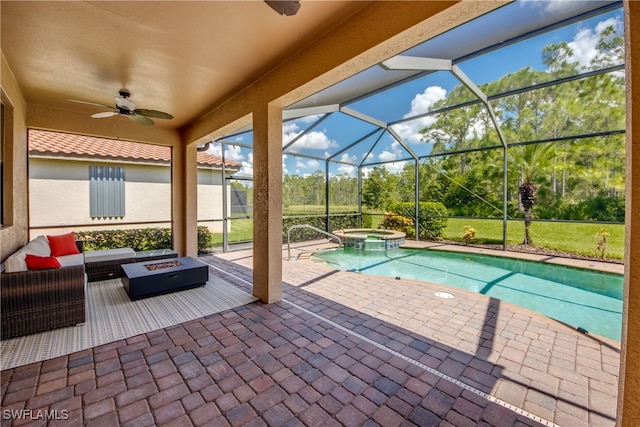 view of swimming pool with a patio, outdoor lounge area, an in ground hot tub, glass enclosure, and ceiling fan