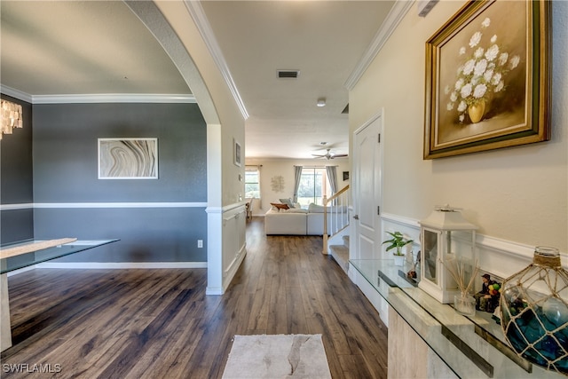 hall featuring crown molding and dark hardwood / wood-style flooring