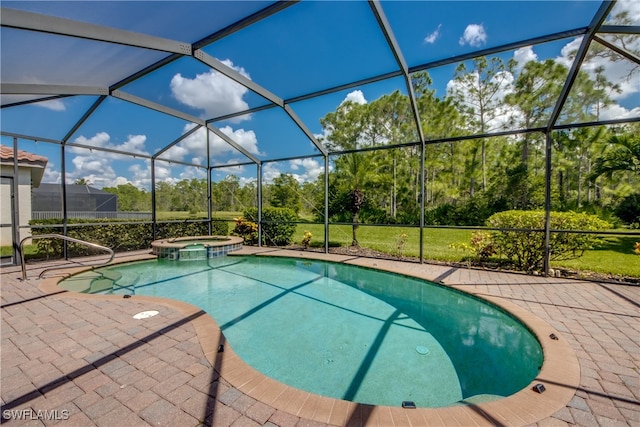 view of swimming pool with a lanai, an in ground hot tub, and a patio area