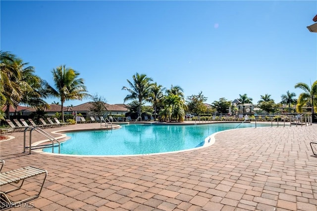 community pool with a patio