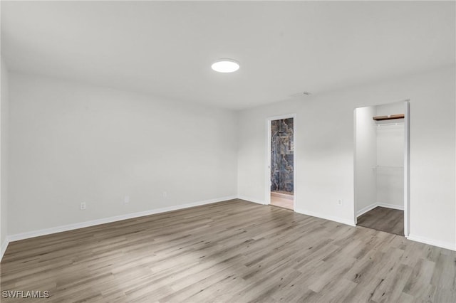 spare room with light wood-type flooring