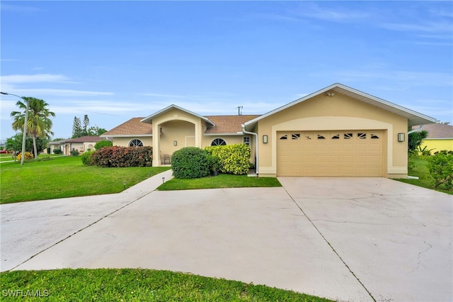 single story home featuring a front lawn and a garage