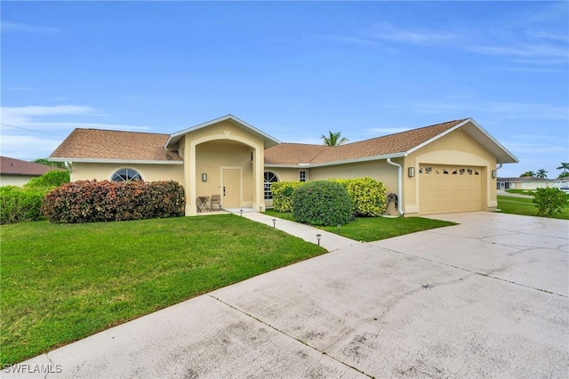 single story home with a garage and a front yard