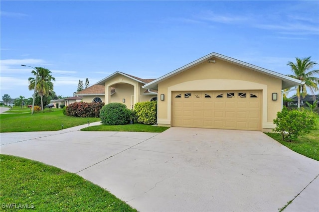 ranch-style home featuring a garage and a front lawn