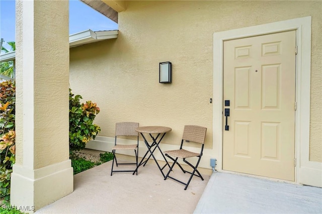 property entrance with a patio