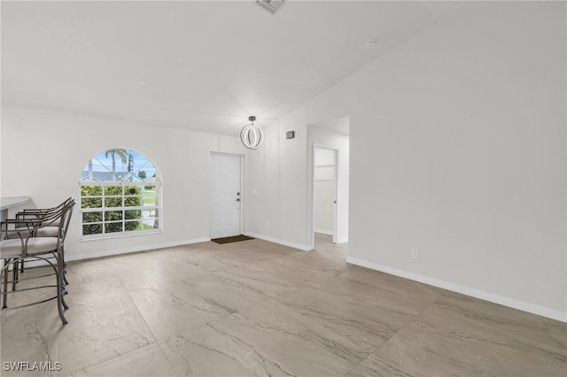 unfurnished living room with lofted ceiling