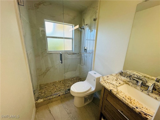 bathroom featuring vanity, toilet, and walk in shower