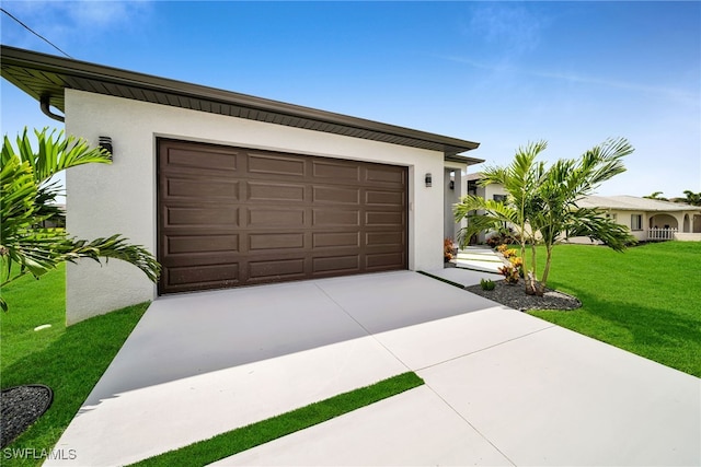 garage featuring a lawn