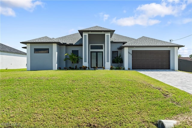 prairie-style home with a garage and a front yard