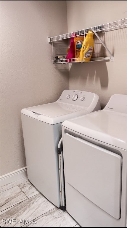 laundry room featuring independent washer and dryer