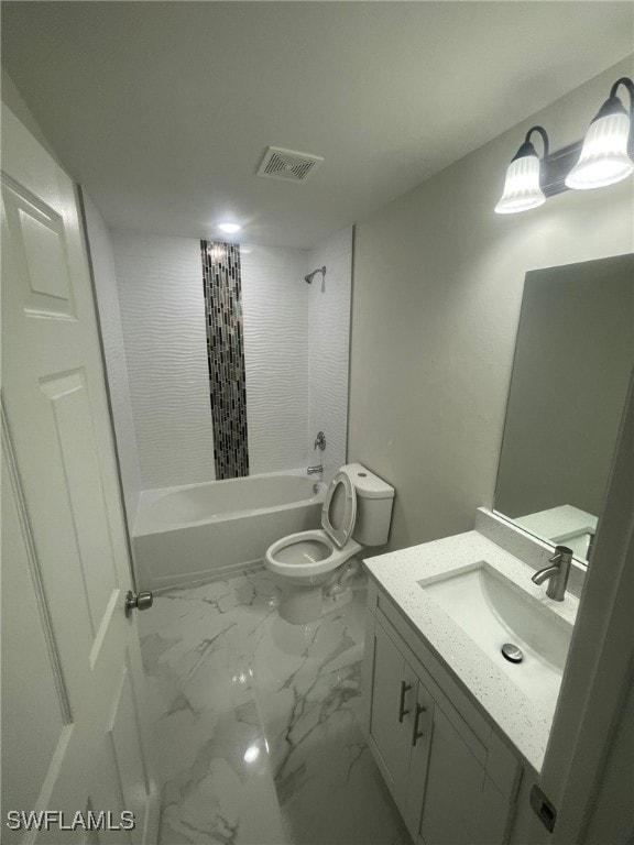 4524/4526 15th St SW, Lehigh Acres, FL 33973 - bathroom featuring vanity, marble finish flooring, bathing tub / shower combination, and toilet