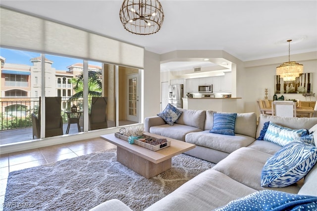 living room featuring light tile patterned floors, ornamental molding, and a chandelier