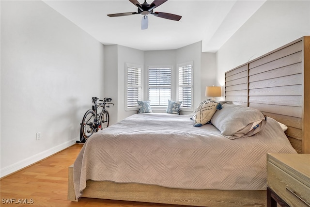 bedroom featuring wood-type flooring and ceiling fan