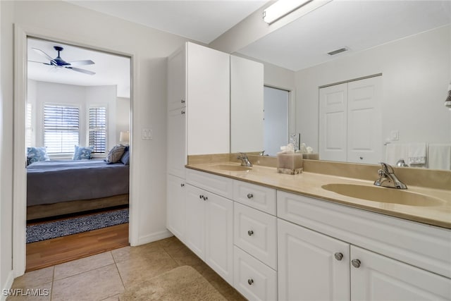 bathroom featuring ceiling fan, vanity, and tile patterned flooring