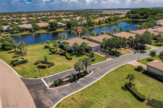 birds eye view of property with a water view