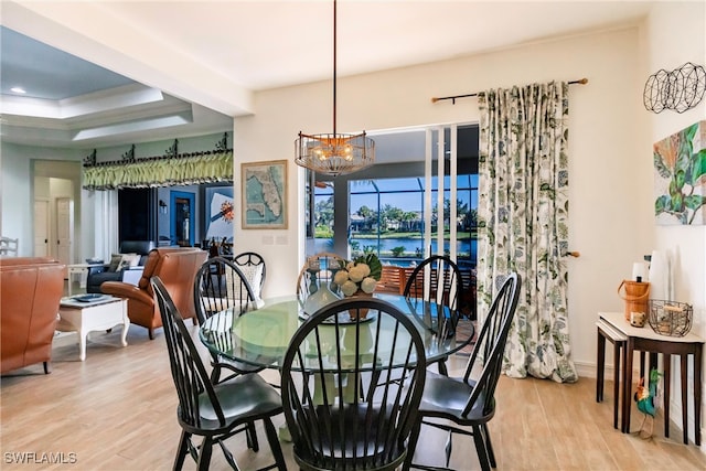 dining room with an inviting chandelier and light hardwood / wood-style floors