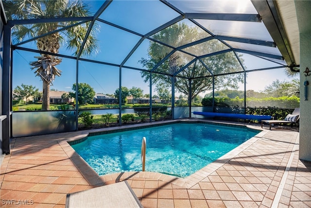 view of swimming pool with a patio, a water view, and a lanai