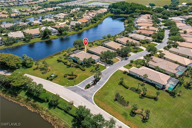 drone / aerial view with a water view