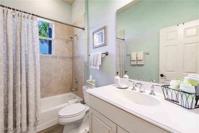 full bathroom with shower / tub combo, vanity, and toilet