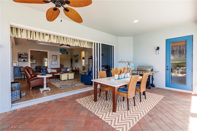 dining area with hardwood / wood-style floors and ceiling fan