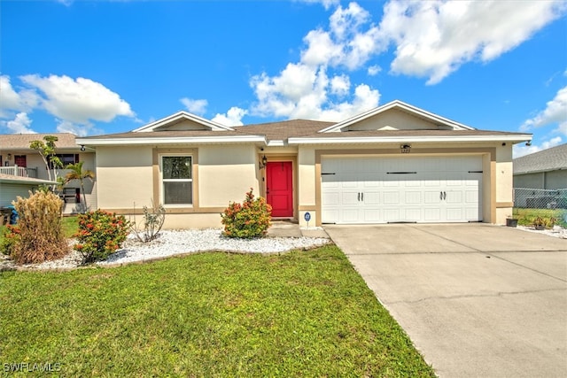 single story home with a front yard and a garage