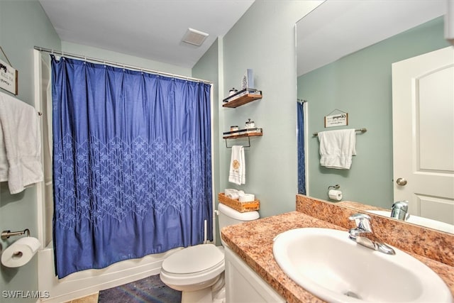 full bathroom featuring shower / tub combo with curtain, vanity, and toilet